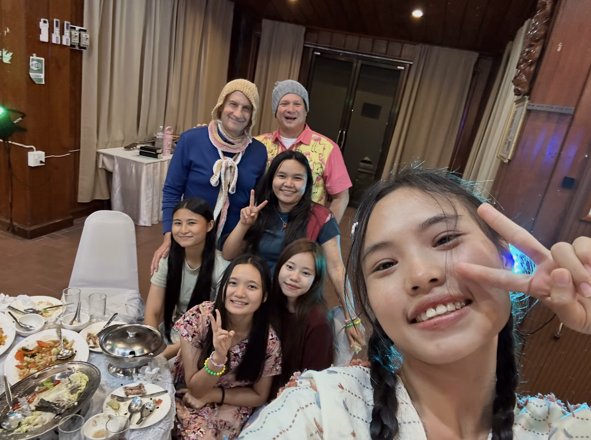 Uncle Bill in his knitted hat surrounded by the girls